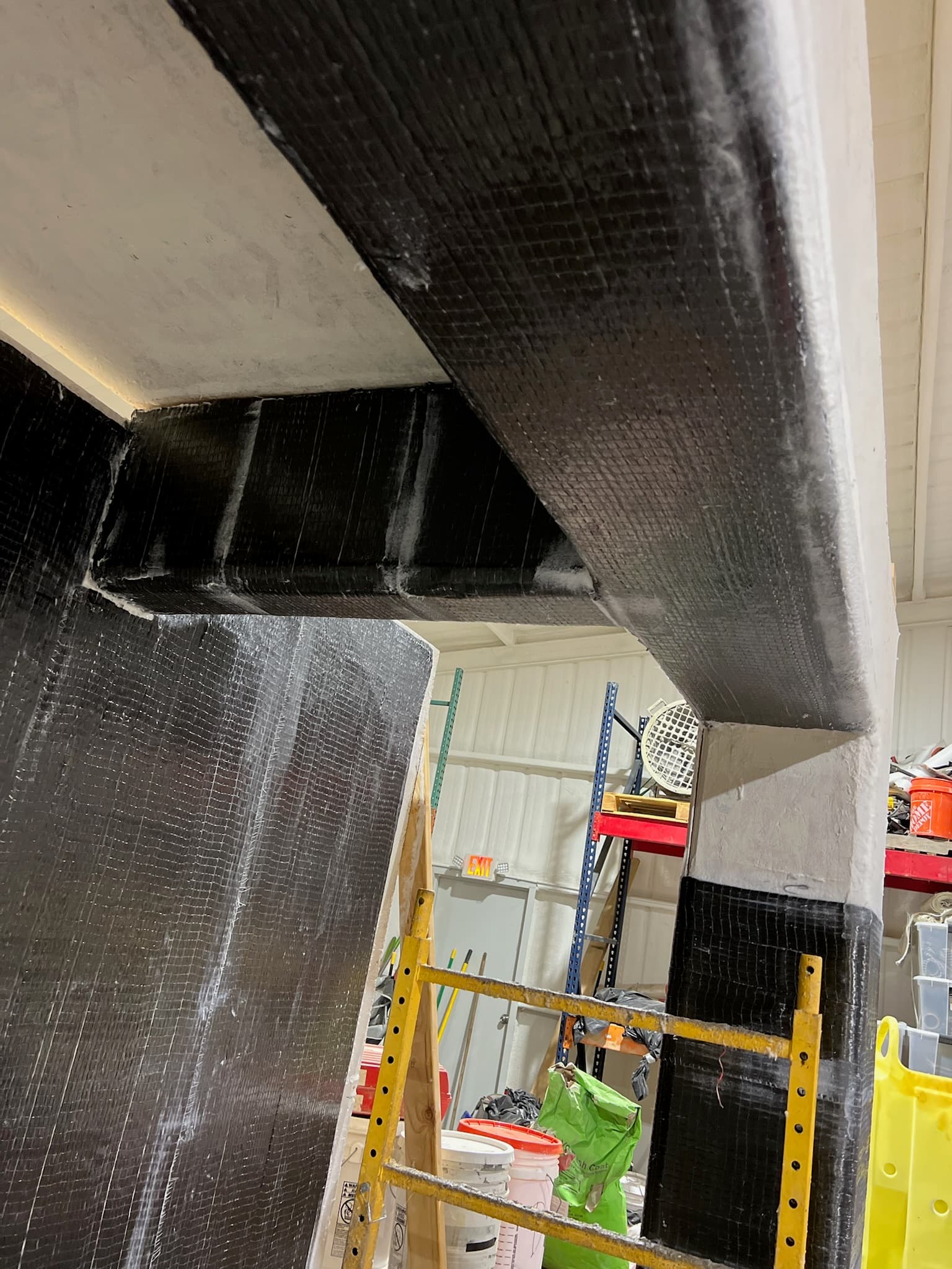 Completed carbon fiber wrap on a beam, wall and column of the training mock-up