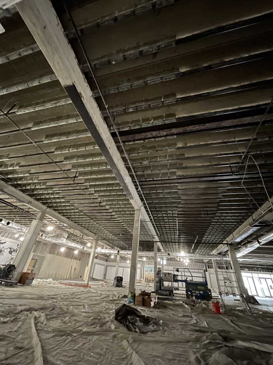 Pan-joist ceiling with carbon fiber bands above a protected floor.