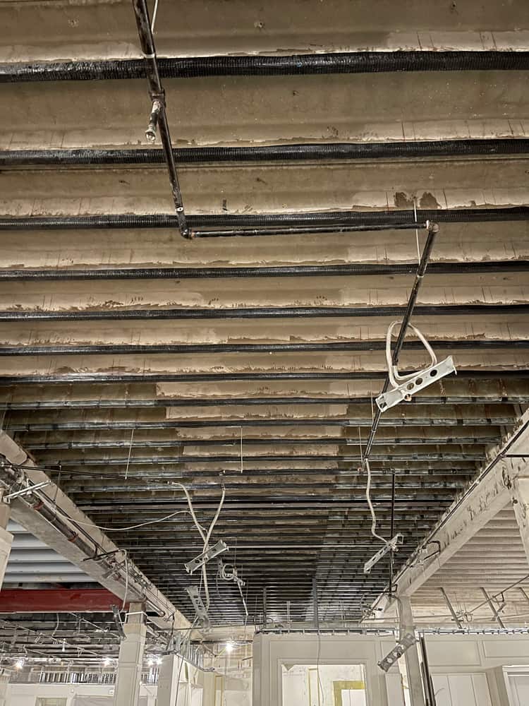 Long joist ceiling with carbon fiber strips along a girder.